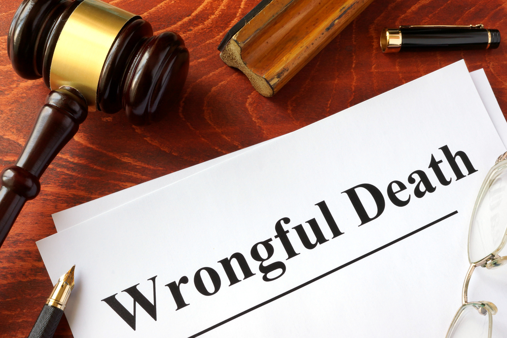 Document titled "wrongful death law" with gavel next to it