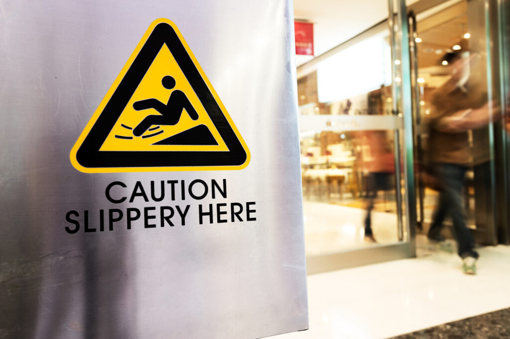 Slip and Fall Lawyer Kansas City, KS - caution sign at store