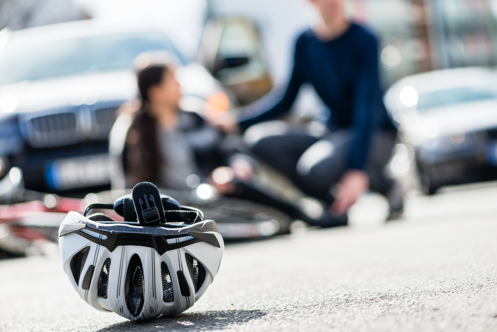 Determining The Value Of A Personal Injury Case - Close-up of a bicycling helmet fallen down on the ground after a