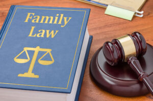 Alimony Lawyer Kansas City, KS - A law book with a gavel - Family law
